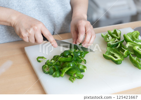 Image of cutting peppers (stock photo) Image of cutting peppers (stock photo) 125421667