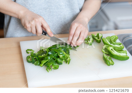 Image of cutting peppers (stock photo) Image of cutting peppers (stock photo) 125421670