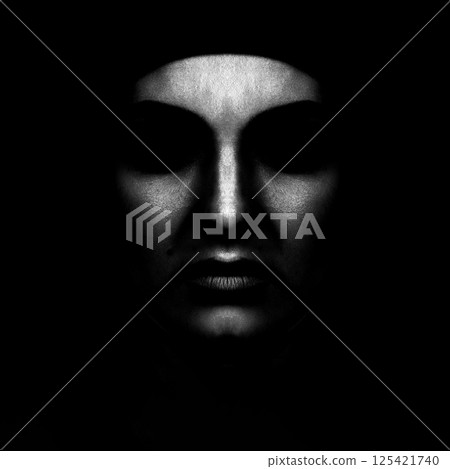 Abstract and scary looking woman face silhouette hiding in shadow 125421740