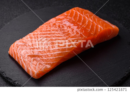 Fresh raw salmon steak with spices and herbs 125421871