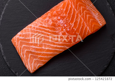 Fresh raw salmon steak with spices and herbs 125421872
