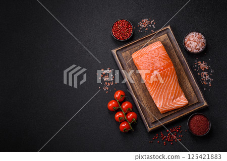 Fresh raw salmon steak with spices and herbs 125421883