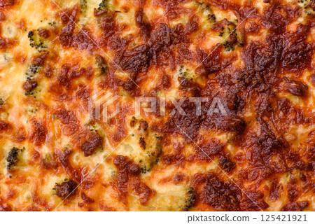 Delicious fresh quiche with broccoli, cheese, spices and herbs 125421921