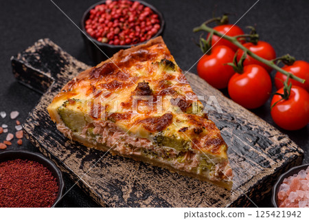 Delicious fresh quiche with broccoli, cheese, spices and herbs Delicious fresh quiche with broccoli, cheese, spices and herbs 125421942
