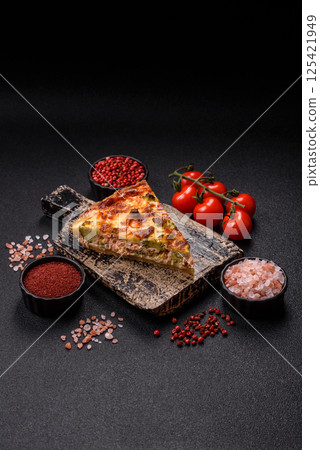 Delicious fresh quiche with broccoli, cheese, spices and herbs Delicious fresh quiche with broccoli, cheese, spices and herbs 125421949