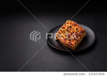 Delicious fresh quiche with broccoli, cheese, spices and herbs 125421950