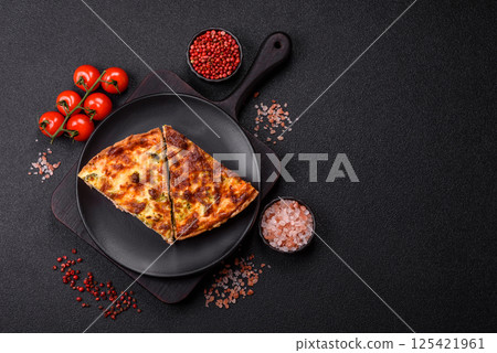 Delicious fresh quiche with broccoli, cheese, spices and herbs Delicious fresh quiche with broccoli, cheese, spices and herbs 125421961