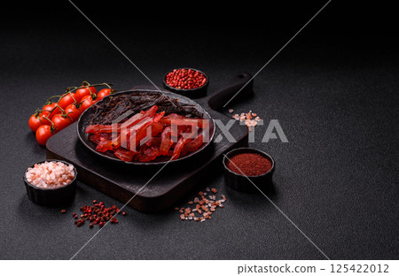 Jerky, dried chicken slices with salt and spices Jerky, dried chicken slices with salt and spices 125422012