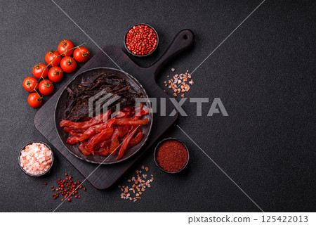 Jerky, dried chicken slices with salt and spices Jerky, dried chicken slices with salt and spices 125422013