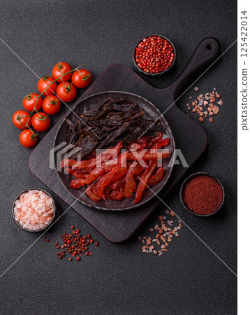 Jerky, dried chicken slices with salt and spices Jerky, dried chicken slices with salt and spices 125422014