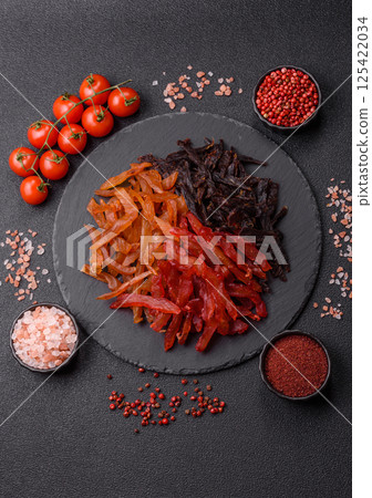 Jerky, dried chicken slices with salt and spices 125422034