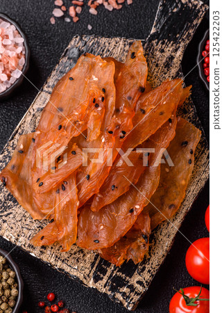 Jerky, dried chicken meat with salt and spices Jerky, dried chicken meat with salt and spices 125422203
