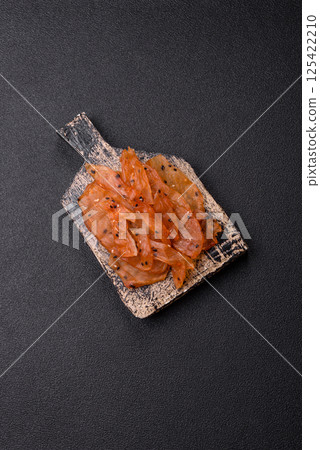 Jerky, dried chicken meat with salt and spices Jerky, dried chicken meat with salt and spices 125422210