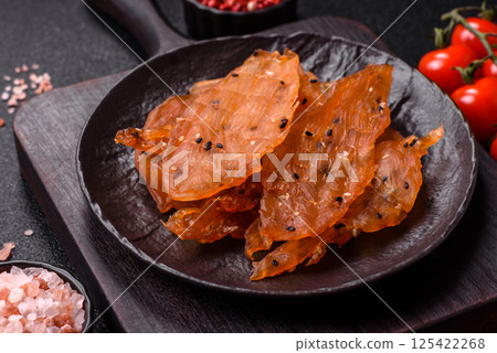 Jerky, dried chicken meat with salt and spices 125422268