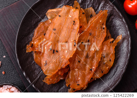 Jerky, dried chicken meat with salt and spices Jerky, dried chicken meat with salt and spices 125422269