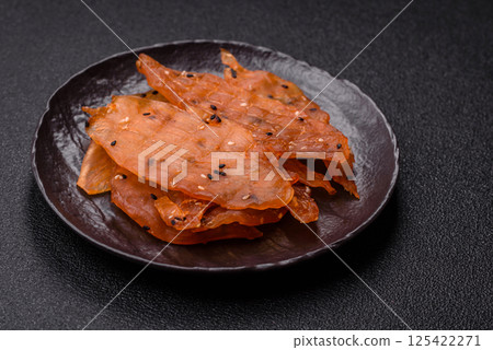 Jerky, dried chicken meat with salt and spices 125422271