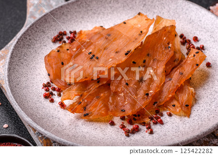 Jerky, dried chicken meat with salt and spices 125422282