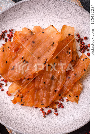 Jerky, dried chicken meat with salt and spices Jerky, dried chicken meat with salt and spices 125422284