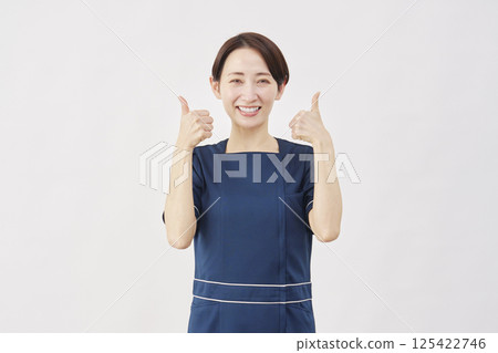 Female beauty nurse good sign with both hands white background Female beauty nurse good sign with both hands white background 125422746