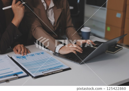 Accounting company provide finance and taxation planning for profitable cash flow, Auditor and accountant team working in office, analyze financial data and accounting record with calculator.Insight 125422860