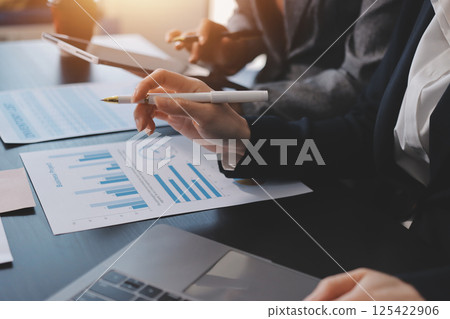 Accounting company provide finance and taxation planning for profitable cash flow, Auditor and accountant team working in office, analyze financial data and accounting record with calculator.Insight Accounting company provide finance and taxation planning for profitable cash flow, Auditor and accountant team working in office, analyze financial data and accounting record with calculator.Insight 125422906