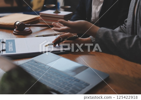 Judge gavel with Justice lawyers having team meeting at law firm background. Concepts of Law and Legal services. Judge gavel with Justice lawyers having team meeting at law firm background. Concepts of Law and Legal services. 125422918