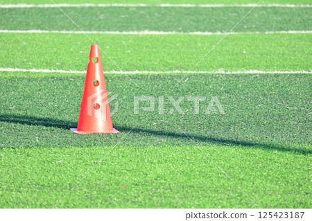 artificial green grass soccer field with orange training cones artificial green grass soccer field with orange training cones 125423187