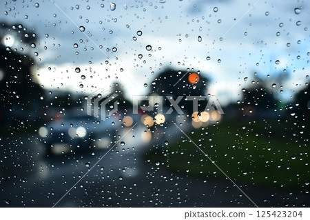 raindrop on windshield, car drive in rainy day weather raindrop on windshield, car drive in rainy day weather 125423204