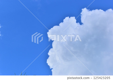 big cloud in clear blue sky background 125423205