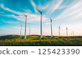 wind turbine farm on mountain hillside 125423390