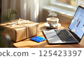 credit card in a cardboard box and laptop 125423397