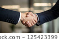 close up of business people shaking hands 125423399