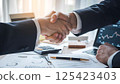 business people shaking hands after meeting 125423403