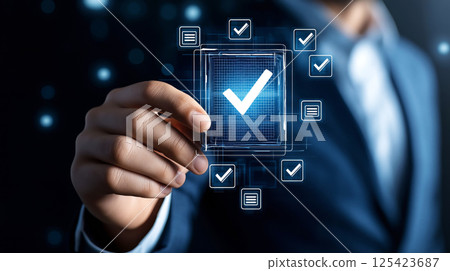 Businessman in suit touching digital checkmark interface for task completion 125423687