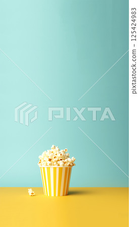 Minimalist vertical composition featuring popcorn against a vibrant blue and yellow background. Perfect for story reels Minimalist vertical composition featuring popcorn against a vibrant blue and yellow background. Perfect for story reels 125424983