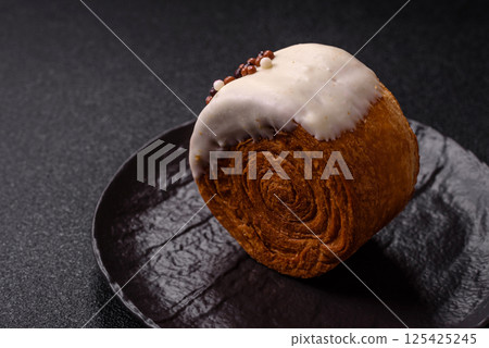Round sweet New York roll croissant with pistachio cream filling 125425245