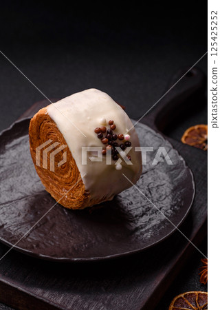 Round sweet New York roll croissant with pistachio cream filling 125425252