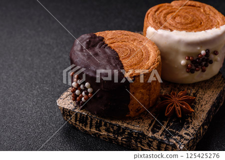 Round sweet New York roll croissant with chocolate cream filling 125425276