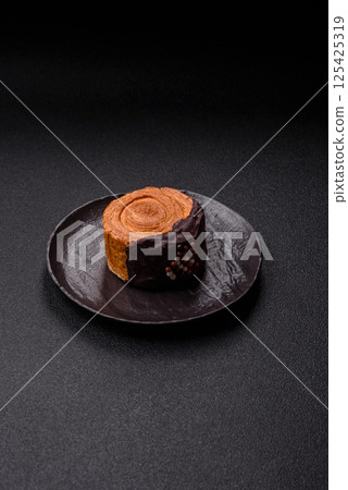 Round sweet New York roll croissant with chocolate cream filling 125425319