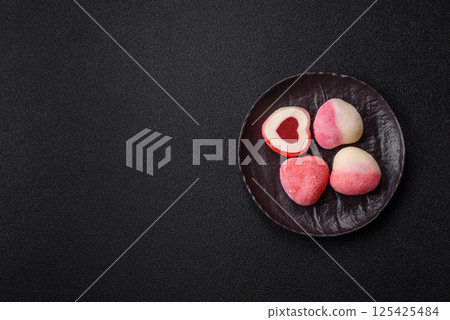 Delicious sweet mochi in the shape of red hearts 125425484