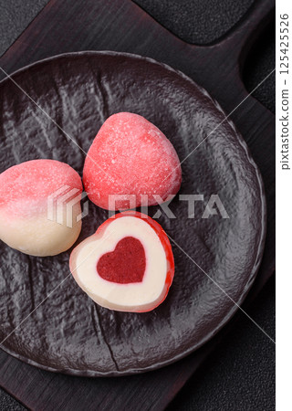 Delicious sweet mochi in the shape of red hearts 125425526