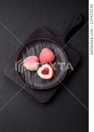 Delicious sweet mochi in the shape of red hearts 125425530