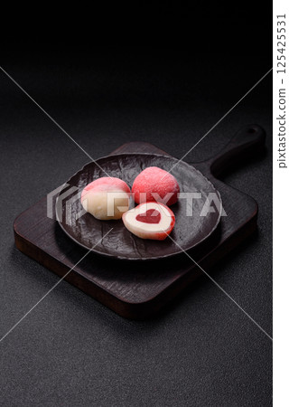 Delicious sweet mochi in the shape of red hearts 125425531