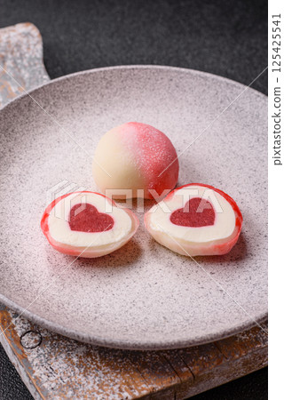 Delicious sweet mochi in the shape of red hearts 125425541