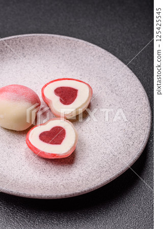 Delicious sweet mochi in the shape of red hearts Delicious sweet mochi in the shape of red hearts 125425545