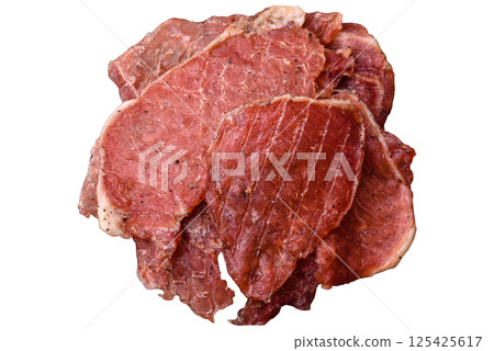 Jerky, dried pork meat slices with salt and spices 125425617