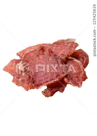 Jerky, dried pork meat slices with salt and spices Jerky, dried pork meat slices with salt and spices 125425619