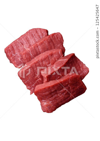 Raw beef tenderloin cut into slices with salt and spices Raw beef tenderloin cut into slices with salt and spices 125425647