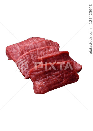 Raw beef tenderloin cut into slices with salt and spices 125425648
