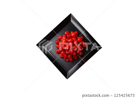 Dried sweet red pitted cherries or candied fruits 125425673